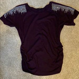 Purple top with sequins on shoulder. Size L.